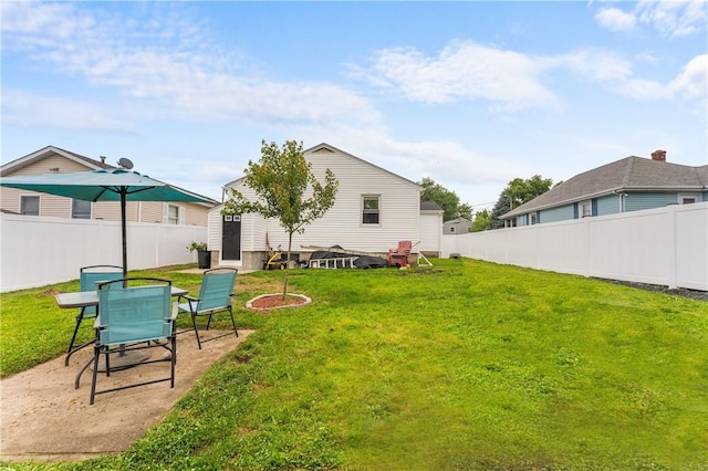 15 Wayland St, East Providence, RI 02914 - fenced backyard with a shed and outdoor dining space
