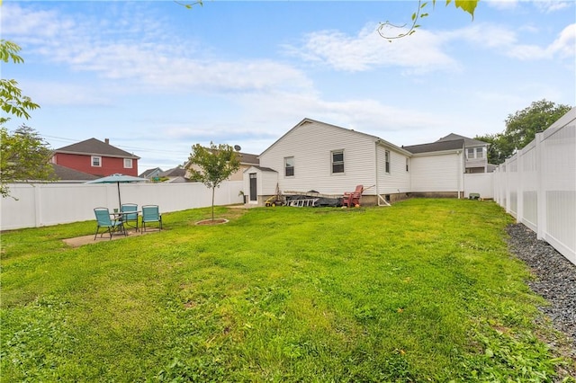 15 Wayland St, East Providence, RI 02914 - back of house with a fenced backyard