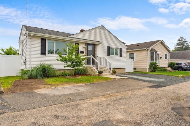 15 Wayland St, East Providence, RI 02914 - view of front of property with a chimney