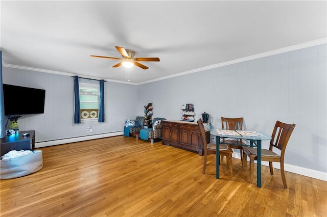 15 Wayland St, East Providence, RI 02914 - dining space with baseboard heating, a ceiling fan, light wood finished floors, and crown molding