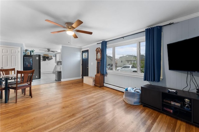 15 Wayland St, East Providence, RI 02914 - living room with ceiling fan, light wood-style flooring, a baseboard radiator, crown molding, and a baseboard heating unit