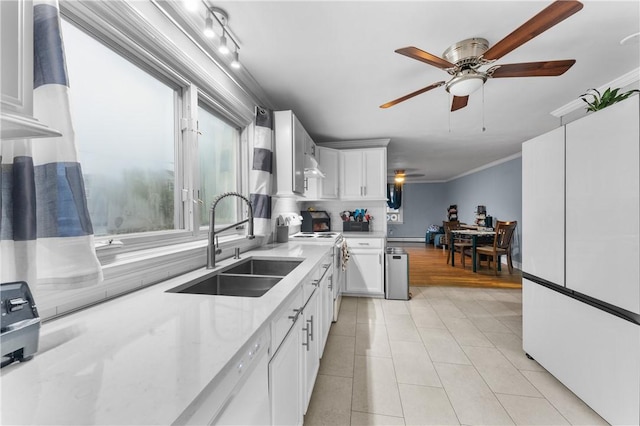 15 Wayland St, East Providence, RI 02914 - kitchen with white appliances, ceiling fan, white cabinetry, light stone counters, and crown molding