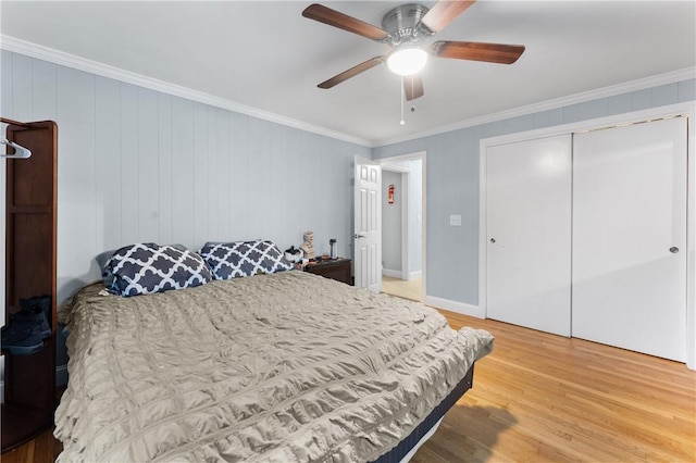 15 Wayland St, East Providence, RI 02914 - bedroom with light wood finished floors, ornamental molding, a ceiling fan, and a closet