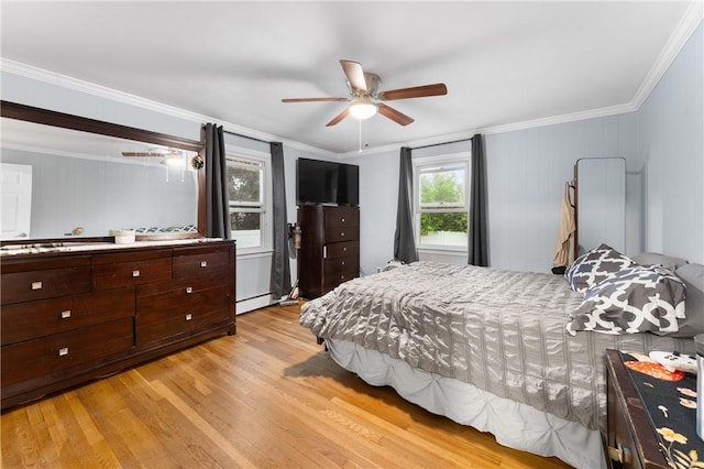 15 Wayland St, East Providence, RI 02914 - bedroom with light wood finished floors, crown molding, a baseboard heating unit, and a ceiling fan