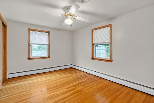 37 Joseph St, Providence, RI 02904 - unfurnished bedroom featuring light wood finished floors, a baseboard heating unit, a closet, ceiling fan, and baseboard heating