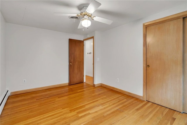 37 Joseph St, Providence, RI 02904 - unfurnished bedroom with a baseboard radiator, light wood-style flooring, a closet, and ceiling fan