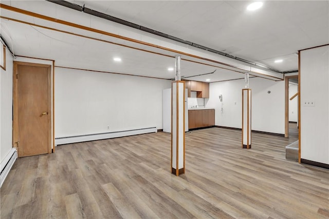 37 Joseph St, Providence, RI 02904 - finished basement featuring a baseboard radiator, light wood-style flooring, recessed lighting, and a baseboard heating unit