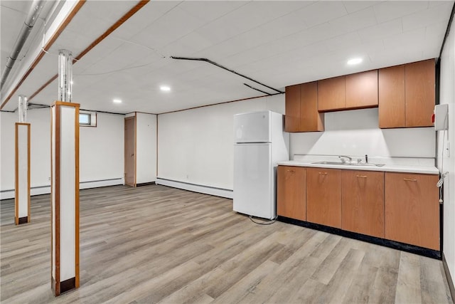 37 Joseph St, Providence, RI 02904 - kitchen with freestanding refrigerator, a baseboard heating unit, light wood-style flooring, light countertops, and recessed lighting