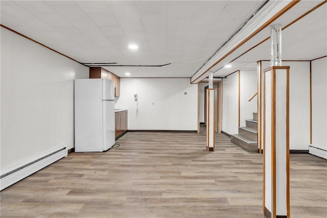 37 Joseph St, Providence, RI 02904 - finished below grade area featuring freestanding refrigerator, a baseboard radiator, light wood finished floors, stairs, and recessed lighting