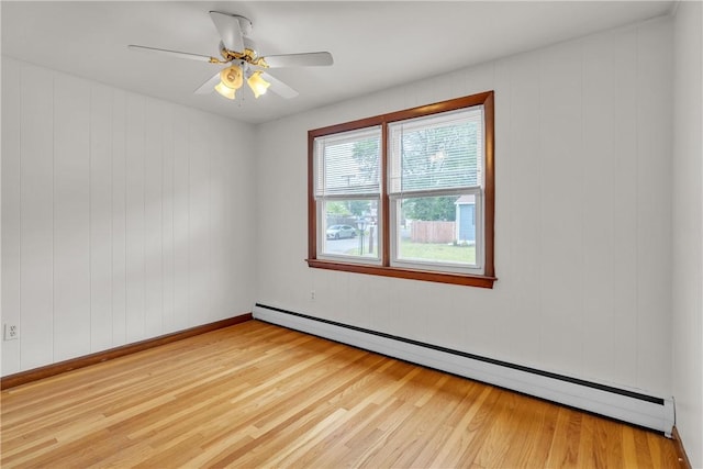 37 Joseph St, Providence, RI 02904 - spare room with a baseboard heating unit, wood finished floors, and a ceiling fan