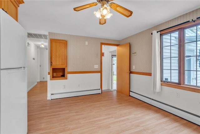 37 Joseph St, Providence, RI 02904 - unfurnished room with baseboard heating, a baseboard heating unit, light wood finished floors, a ceiling fan, and wallpapered walls