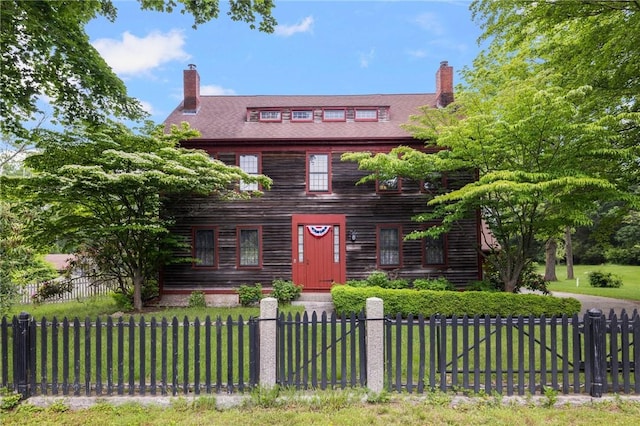 2381 Middle Rd, East Greenwich, RI 02818 - view of front facade featuring a chimney and a fenced front yard