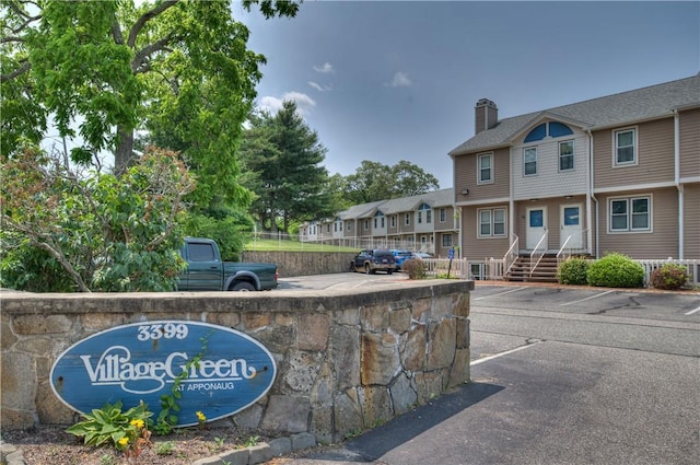 3399 Post Rd Unit 4, Warwick, RI 02886 - community sign with uncovered parking and a residential view