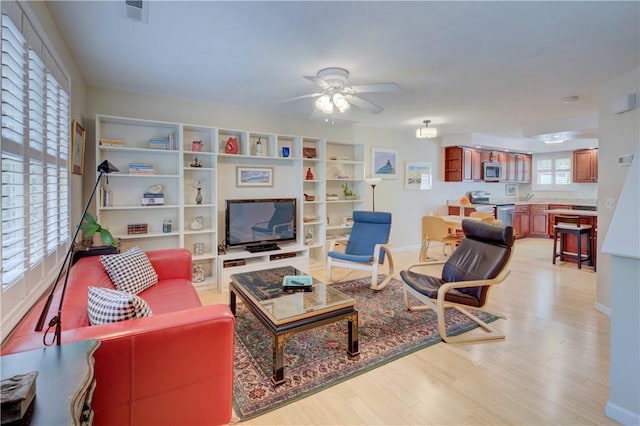 3399 Post Rd Unit 4, Warwick, RI 02886 - living room with a ceiling fan and light wood finished floors