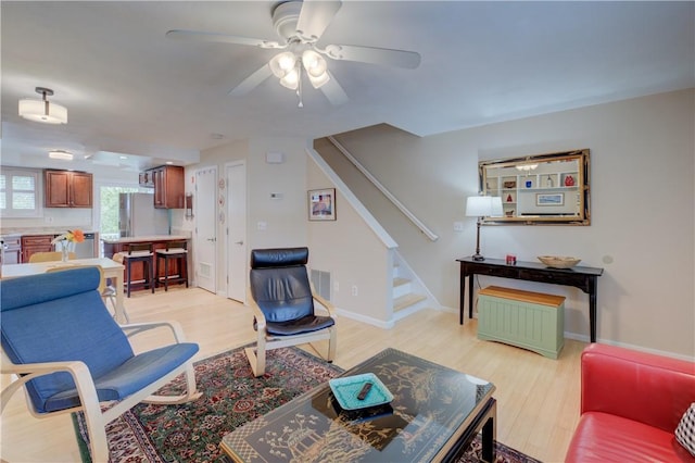 3399 Post Rd Unit 4, Warwick, RI 02886 - living area with stairway, light wood finished floors, and ceiling fan