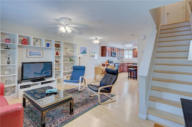 3399 Post Rd Unit 4, Warwick, RI 02886 - living area featuring stairway, ceiling fan, and light wood-type flooring