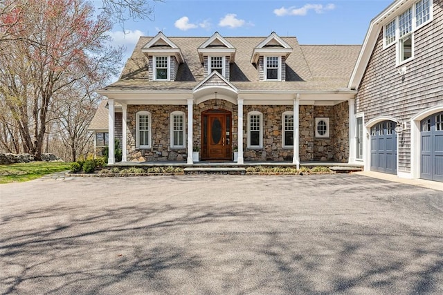 7 Spring Pond Rd, Westerly, RI 02891 - shingle-style home featuring a porch, stone siding, asphalt driveway, and a shingled roof