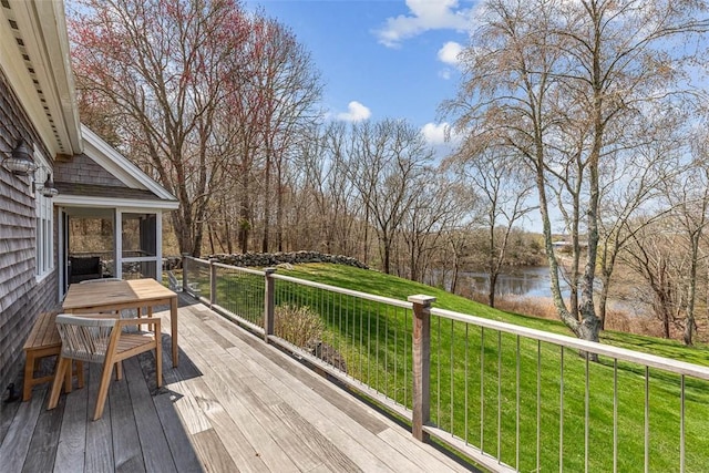 7 Spring Pond Rd, Westerly, RI 02891 - deck featuring a water view, a lawn, view of wooded area, and a sunroom