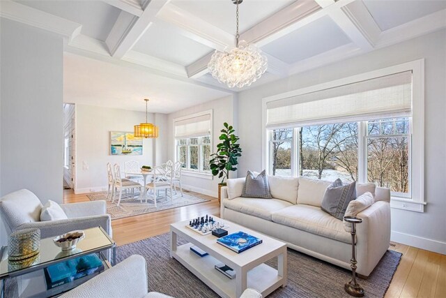 7 Spring Pond Rd, Westerly, RI 02891 - living area featuring a chandelier, light wood finished floors, coffered ceiling, and beamed ceiling