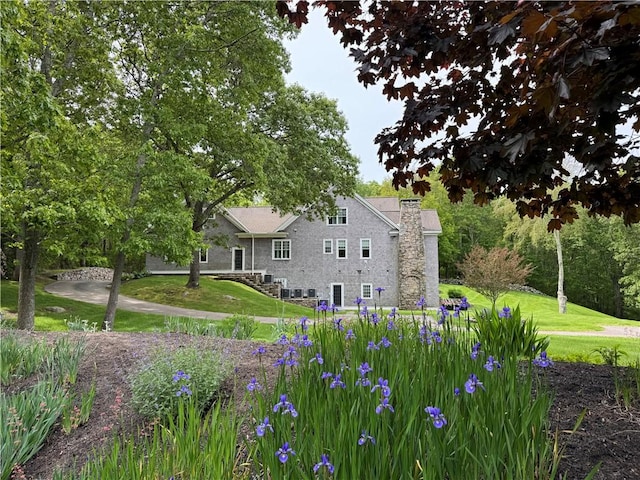7 Spring Pond Rd, Westerly, RI 02891 - rear view of property with a chimney and a yard