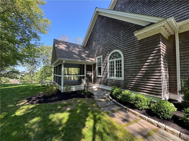 7 Spring Pond Rd, Westerly, RI 02891 - view of home's exterior featuring a sunroom, a lawn, and roof with shingles