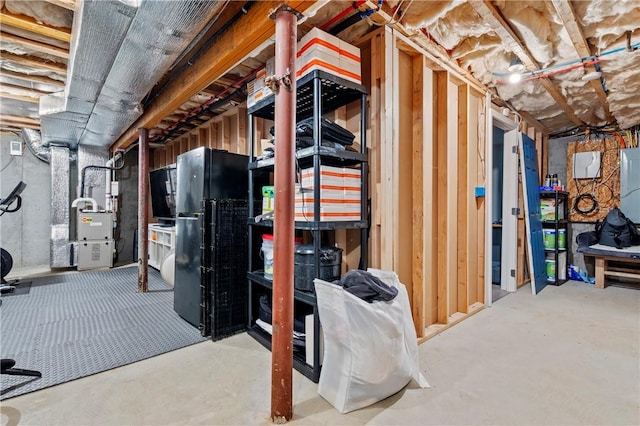 3560 Diamond Hill Rd, Cumberland, RI 02864 - unfinished basement with freestanding refrigerator and heating unit