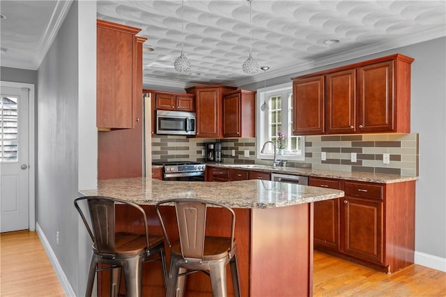 3560 Diamond Hill Rd, Cumberland, RI 02864 - kitchen with appliances with stainless steel finishes, light stone counters, decorative backsplash, a peninsula, and ornamental molding