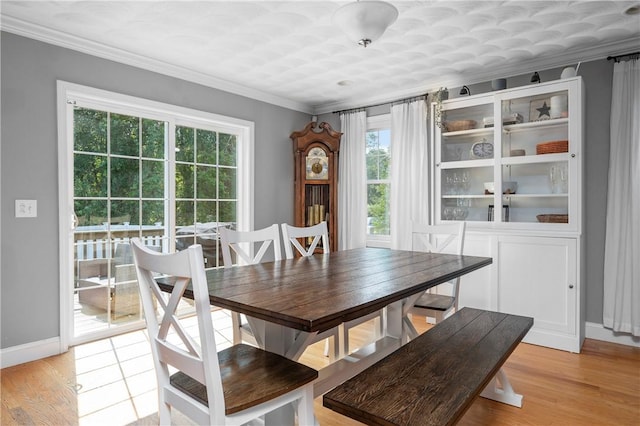 3560 Diamond Hill Rd, Cumberland, RI 02864 - dining room featuring light wood-style floors and crown molding
