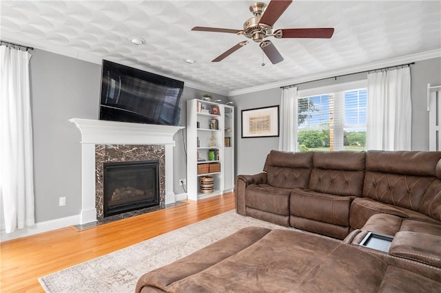 3560 Diamond Hill Rd, Cumberland, RI 02864 - living area with wood finished floors, a ceiling fan, crown molding, and a premium fireplace