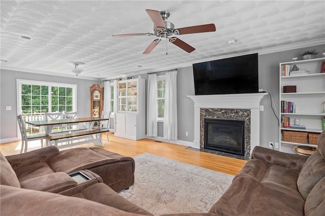 3560 Diamond Hill Rd, Cumberland, RI 02864 - living room featuring ornamental molding, ceiling fan, wood finished floors, and a high end fireplace