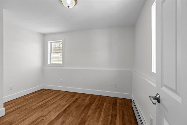 621 Thames St Unit C, Newport, RI 02840 - unfurnished room with a baseboard radiator and wood finished floors