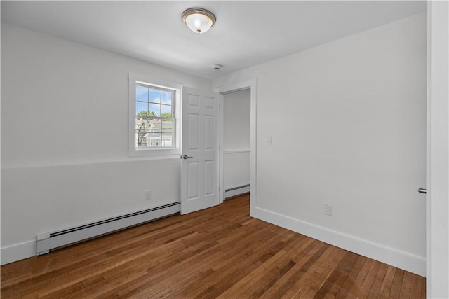 621 Thames St Unit C, Newport, RI 02840 - spare room with a baseboard radiator and wood finished floors