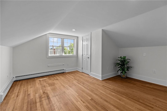 621 Thames St Unit C, Newport, RI 02840 - additional living space with vaulted ceiling, light wood-style flooring, and a baseboard radiator