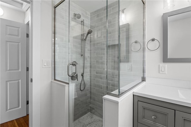 621 Thames St Unit C, Newport, RI 02840 - full bathroom with tiled shower, vanity, and wood finished floors