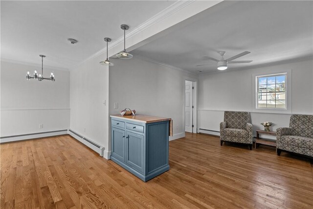 621 Thames St Unit C, Newport, RI 02840 - kitchen featuring blue cabinetry, crown molding, a chandelier, light wood-style floors, and ceiling fan