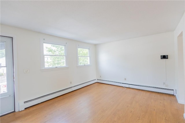 22 Gage St Unit 101, Providence, RI 02909 - empty room featuring wood finished floors and a baseboard radiator
