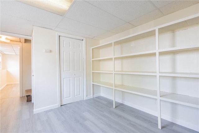 22 Gage St Unit 101, Providence, RI 02909 - unfurnished bedroom with wood finished floors and a drop ceiling