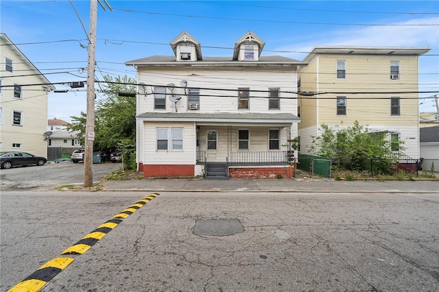423 Pine St, Central Falls, RI 02863 - view of front of house featuring a balcony and a porch