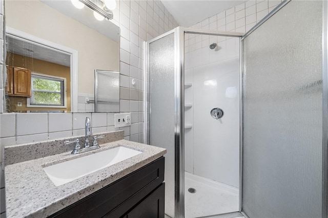 423 Pine St, Central Falls, RI 02863 - bathroom featuring tile walls, a stall shower, and vanity