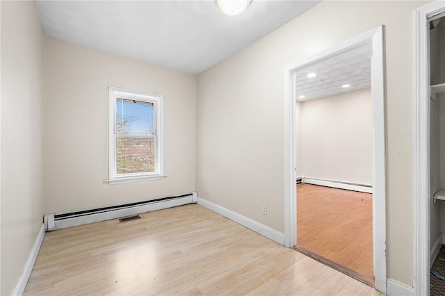 423 Pine St, Central Falls, RI 02863 - unfurnished room featuring a baseboard radiator, wood finished floors, and recessed lighting