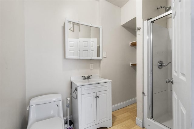 423 Pine St, Central Falls, RI 02863 - full bath featuring vanity, a shower stall, and wood finished floors