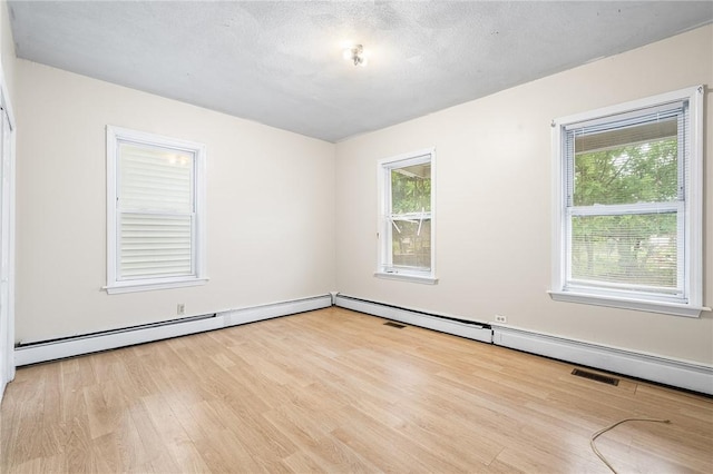423 Pine St, Central Falls, RI 02863 - spare room featuring healthy amount of natural light and wood finished floors