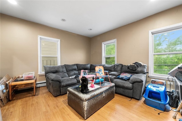 423 Pine St, Central Falls, RI 02863 - living area with light wood-type flooring, healthy amount of natural light, baseboard heating, and recessed lighting