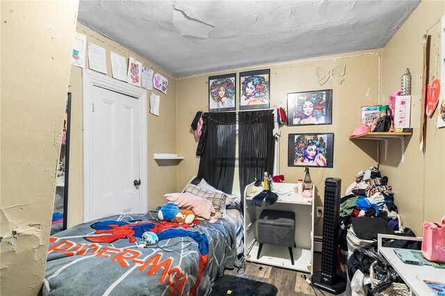 423 Pine St, Central Falls, RI 02863 - bedroom with wood finished floors and an office area