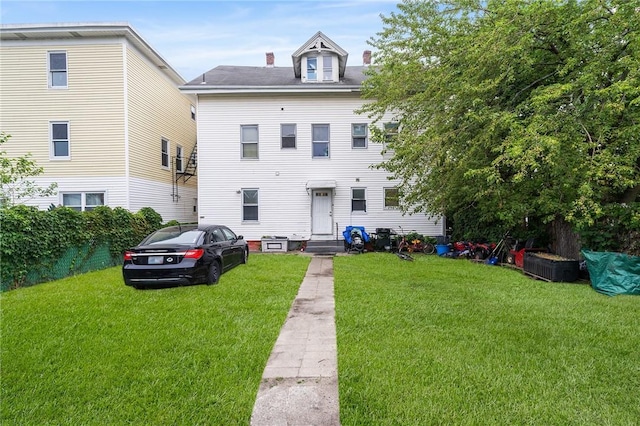 423 Pine St, Central Falls, RI 02863 - townhome / multi-family property featuring a front yard and entry steps
