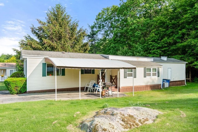 29 Cantaberry Ln, Coventry, RI 02816 - view of front of property with a front lawn and a patio
