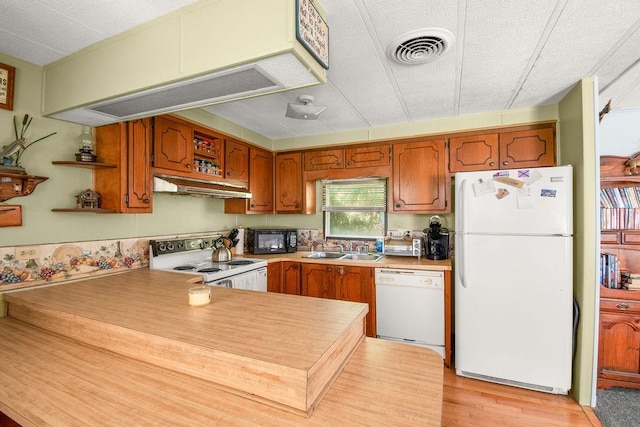 29 Cantaberry Ln, Coventry, RI 02816 - kitchen featuring white appliances, under cabinet range hood, open shelves, light wood-style flooring, and brown cabinets