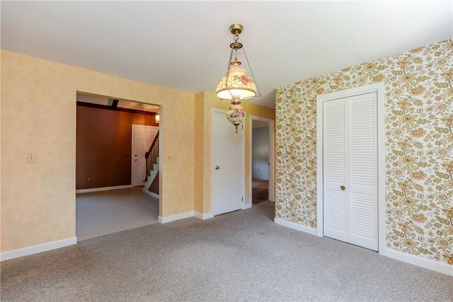 14 Meadow View Dr, Smithfield, RI 02917 - carpeted empty room featuring stairway and wallpapered walls