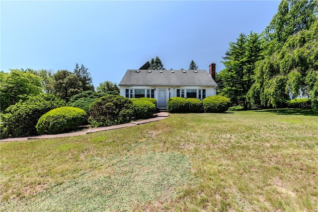 14 Meadow View Dr, Smithfield, RI 02917 - view of front of home featuring a front lawn and a chimney