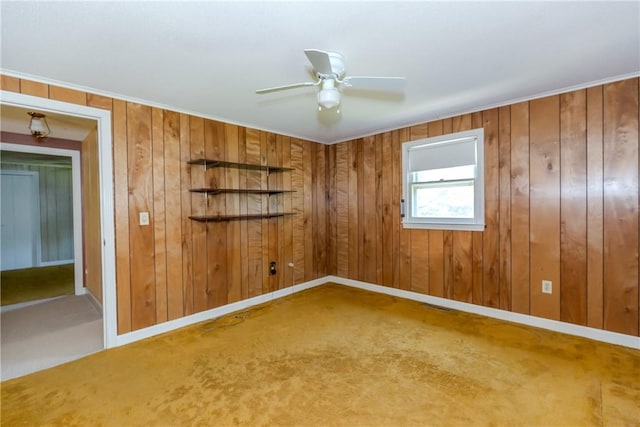 14 Meadow View Dr, Smithfield, RI 02917 - empty room featuring carpet floors, wooden walls, ceiling fan, and crown molding